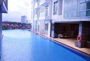 a large swimming pool in the middle of a building at KSL Mall - High Speed WiFi - Bathtub - Netflix - 24-7 Support in Johor Bahru