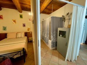 a bedroom with a bed and a sliding glass door at 1912 - Flowers Room - budget for young in Locarno