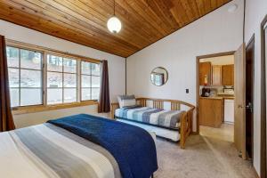 a bedroom with two beds and a kitchen at Bay Point Hillside 17A Up in Whitefish +43 photos