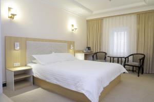 Voodi või voodid majutusasutuse Hotel Grand Royal Jizzakh toas +22 fotot