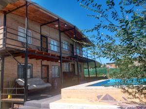 a house with a pool in front of it at La Posada De Vito in Córdoba