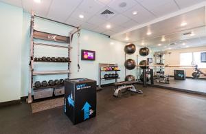 a gym with dumbbells and weights in a room at Tru By Hilton Florida City, Fl in Florida City