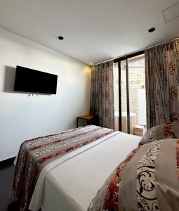 Hotel Cartagena DC客房内的一张或多张床位