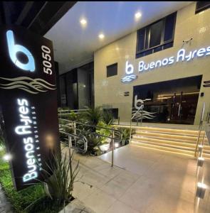 a building with a sign in front of it at Apto Novo PraiaTambaúCabo Branco in João Pessoa