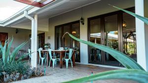 a patio with a table and chairs on it at Jonkershoek Guest Farm in Kimberley