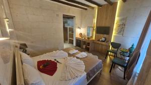 מיטה או מיטות בחדר ב-CAPPADOCIA MİHRAN SULTAN