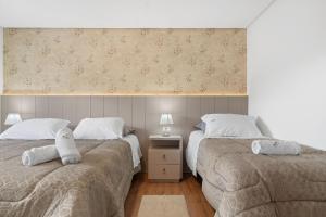 Postel nebo postele na pokoji v ubytování Solar da Garibaldi 3 Suítes by Achei Gramado