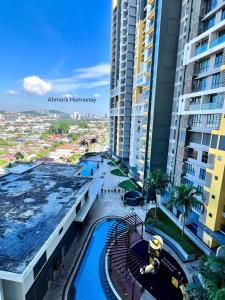 a view of a water park in front of tall buildings at Silk Sky Residence, Pool View, High Speed Wi-Fi, TVBox, C180, Cheras, C180, Aeon Cheras Selatan, Balakong in Seri Kembangan