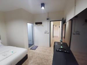 Postel nebo postele na pokoji v ubytování The One Hotel