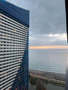 a view of the ocean from a tall building at Orbi CITY Luxury Suite in Batumi