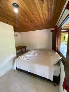 Cama ou camas em um quarto em Eco Pousada Mentawai