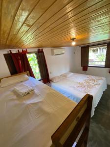 Cama ou camas em um quarto em Eco Pousada Mentawai