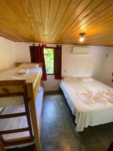 Cama ou camas em um quarto em Eco Pousada Mentawai