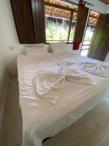 Cama ou camas em um quarto em Eco Pousada Mentawai