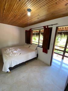 Cama ou camas em um quarto em Eco Pousada Mentawai