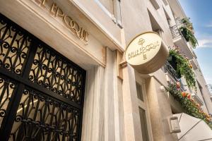 a building with a sign on the side of it at Belle Epoque Suites in Athens +32 photos