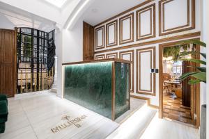a large aquarium in the middle of a room at Belle Epoque Suites in Athens