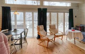 a dining room with a table and chairs at 2 Bedroom Cozy Home In Klssbol in Klässbol