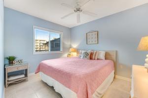 a bedroom with a bed and a window at Surf Watch 104 in Ocean City