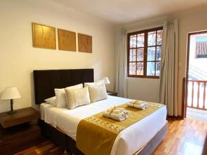 Cama ou camas em um quarto em Katari at Plaza de Armas Cusco