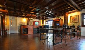 a large room with a table and chairs in it at Travelbee Heritage Inn in Dapitan +8 photos