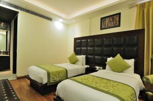 Postel nebo postele na pokoji v ubytování Hotel Smart Stay