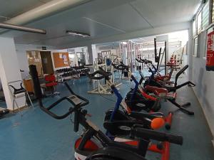 a gym with a bunch of exercise bikes in it at Playa Cannet del Berenguer 7 pers piscina tennis in Canet de Berenguer