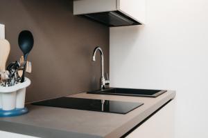 Kuchyň nebo kuchyňský kout v ubytování Winning Apartments + 33 fotografií
