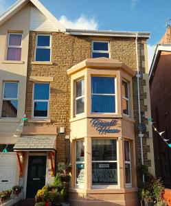 a store front of a brick building at Rossall House , For Families & Couples in Blackpool