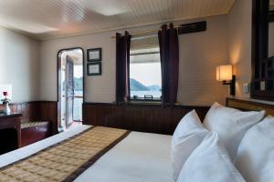 Ліжко або ліжка в номері Emeraude Classic Cruises