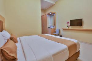 Krevet ili kreveti u jedinici u okviru objekta The Horizontal Hotel Pacitan