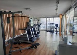 a gym with several treadmills and machines in a room at Edificio Calypso - Primera línea al Mar in Punta del Este