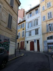 an alley with buildings and a car parked next to a street at FLC-PANIER- OLD PORT 500m - T3- 2 Bedrooms -Maxi 6 Guests in Marseille