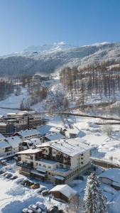 an aerial view of a building in the snow at Hotel Hubertus in Sölden