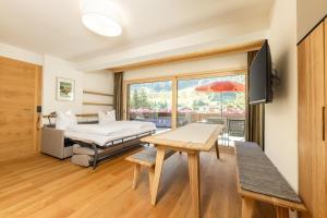 TV a/nebo společenská místnost v ubytování Pension Gulla - Ferienhaus Appartements B&B