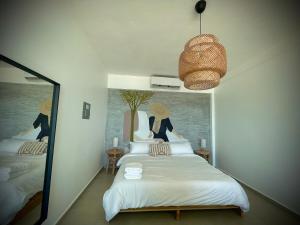 Voodi või voodid majutusasutuse 1 Corcega Beachfront Suites toas