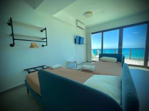 Voodi või voodid majutusasutuse 1 Corcega Beachfront Suites toas