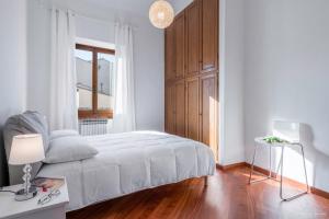 Un pat sau paturi într-o cameră la Casa tua Santo Spirito