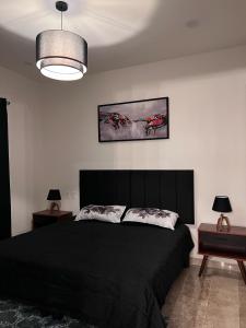 Un pat sau paturi într-o cameră la Hermoso y acogedor Penthouse