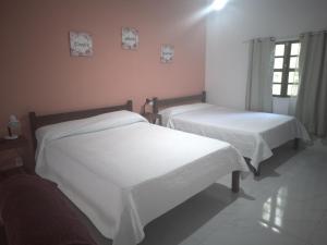 Giường trong phòng chung tại Marina Guest House