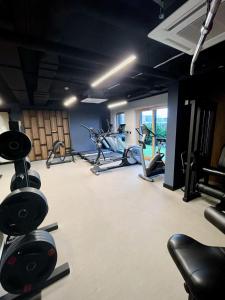 a gym with several treadmills and exercise bikes at Old Town Nadmotławie - Sauna & Gym I 10min deptak in Gdańsk