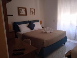 Кровать или кровати в номере B&B Suite and Rooms San Giovanni