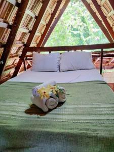 Ένα ή περισσότερα κρεβάτια σε δωμάτιο στο Chalé da Lua