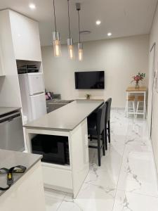 Η κουζίνα ή μικρή κουζίνα στο Guest House - Self Contained