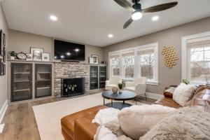 a living room with a couch and a fireplace at Riverside Retreat! in West Lafayette