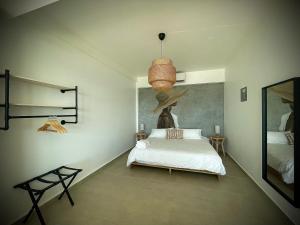 Voodi või voodid majutusasutuse 1 Corcega Beachfront Suites toas