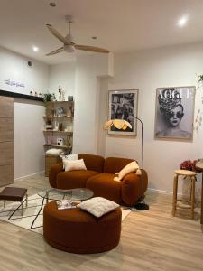 a living room with a couch and a table at Athéna in Caen