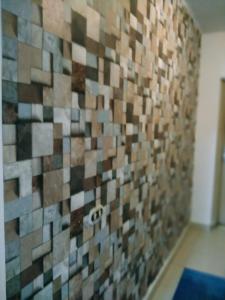 a mosaic tile wall in a room at Shared room with the owner only at the Delta Hotel and Resort Sharm El Sheikh in Sharm El Sheikh