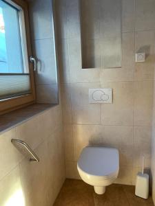 Koupelna v ubytování Haus Hofer + 9 fotografií