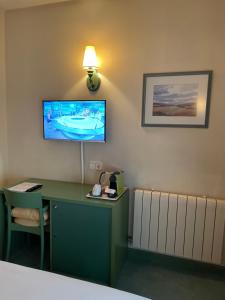 TV a/nebo společenská místnost v ubytování Hostal Navarra